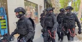 Police heading to the Sciences Po building in Paris, May 3, 2024.
