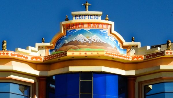 A painting of the Andes and a statue of Jesus decorate the highest point of this building