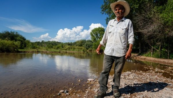 A local farmer stands besides the Sonora River, which was contaminated in August by the Buenavista Copper mine (Photo: Clayton Conn)