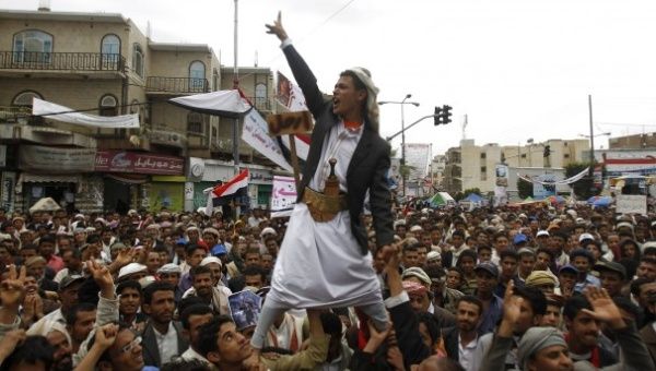 an_anti-government_protester_is_carried_by_fellow_protesters_as_he_shouts_slogans_during_a_rally_to_demand_the_ouster_of_yemenxs_president_ali_abdullah_saleh_outside_sanaa_university..jpg_1718483346.jpg