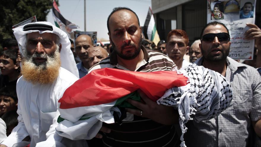 Miles de personas habían acompañado en el funeral al bebe quemado en la ciudad cisjordana de Nablus el 31 de julio de 2015.