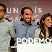 Podemos (We Can) party leader Pablo Iglesias (2nd L) stands with party members at party headquarters after polls closed in Spain