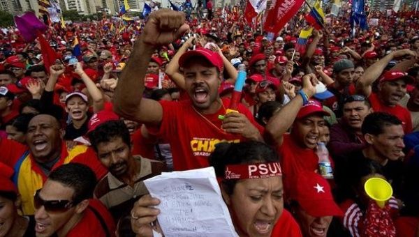 Supporters of Venezuelan President Hugo Chavez attend his campaign closure rally in Caracas, on October 4, 2012.