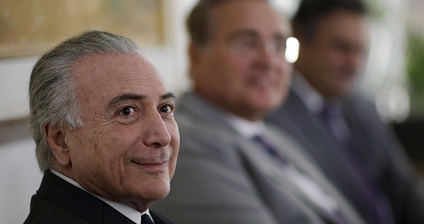 Brazil's Vice President Michel Temer (L) looks on near Neves (R) of the Brazilian Social Democracy Party (PSDB) during a meeting in Brasilia.