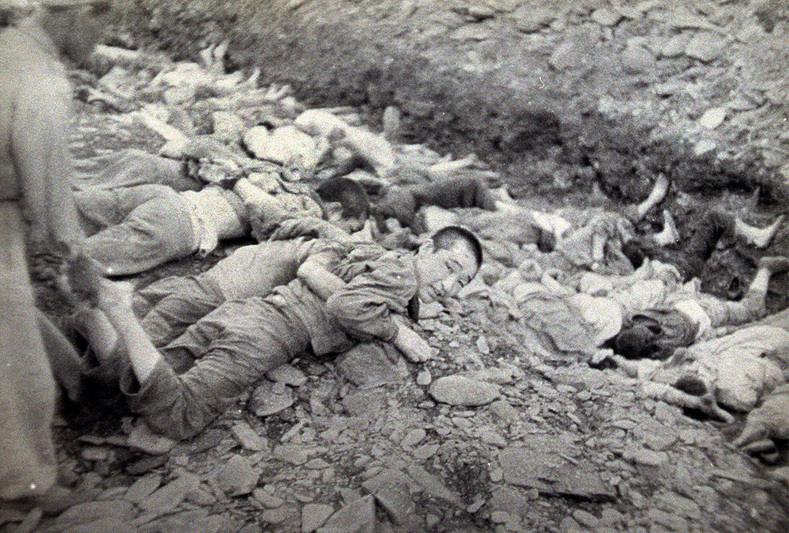 This U.S. Army photograph, once classified "top secret", is one of a series depicting the summary execution of 1,800 South Korean political prisoners by the U.S.-backed South Korean military at Taejon, South Korea, over three days in July 1950. Historians and survivors claim South Korean troops executed many civilians behind frontlines as U.N. forces retreated before the North Korean army in mid-1950, on suspicion that they were communist sympathizers and might collaborate with the advancing enemy. 