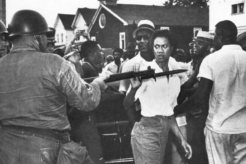 Gloria Richardson, seen here defiantly pushing aside a National Guard rifle, was a fearless organizer and leader of the Cambridge Movement in Cambridge, Maryland, in the 1960s. The movement evolved into a battle for the economic rights of Cambridge citizens, many of whom were faced with low wages and unemployment. Known as "Glorious Gloria," many considered her to be a tough leader akin to a second Harriet Tubman.