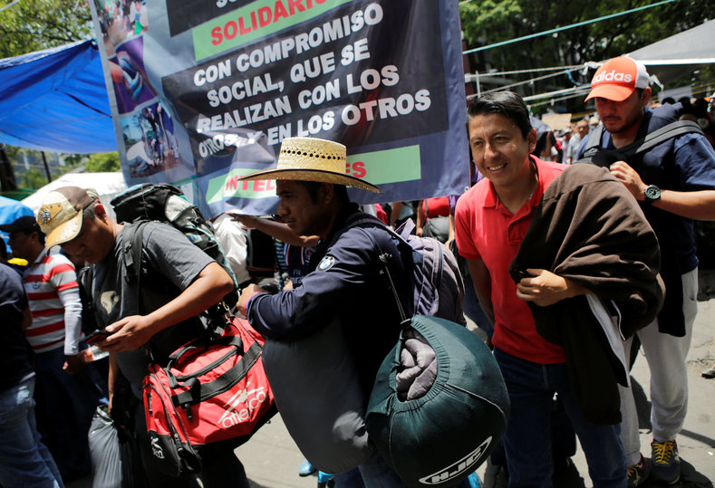 Protesters from the National Coordinator of Education Workers (CNTE) teachers' union arrive in Mexico City to attend the march against President Enrique Peña Nieto