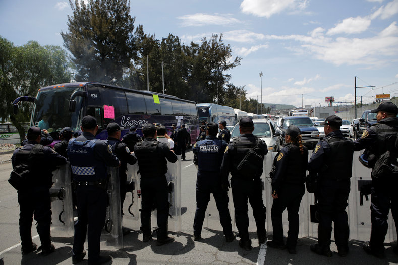 Protesters from the National Coordinator of Education Workers (CNTE) teachers' union arrive in Mexico City to attend a march against President Enrique Peña Nieto