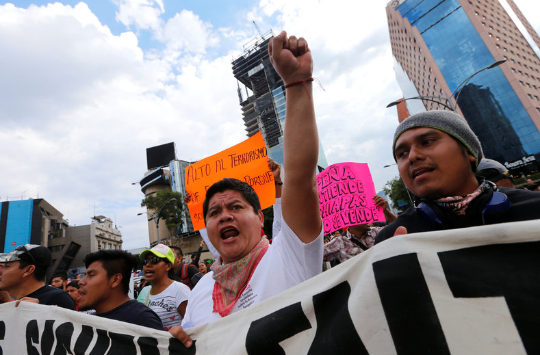 Protesters from the National Coordinator of Education Workers (CNTE) teachers' union march against President Enrique Peña Nieto