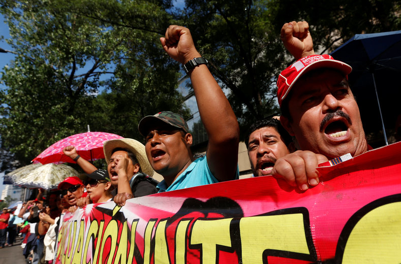 Protesters from the National Coordinator of Education Workers (CNTE) teachers' union march against President Enrique Pena Nieto