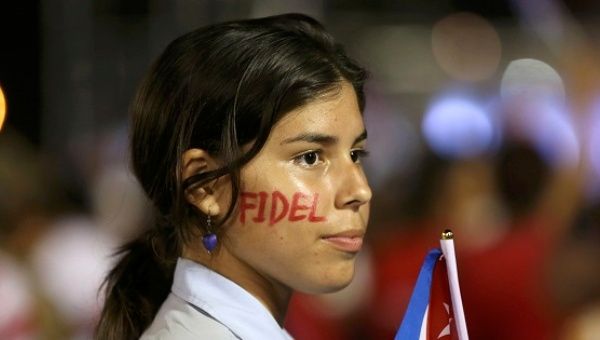 A student wearing face paint attends a tribute to former Cuban President Fidel Castro in Santiago de Cuba, Dec. 3, 2016.