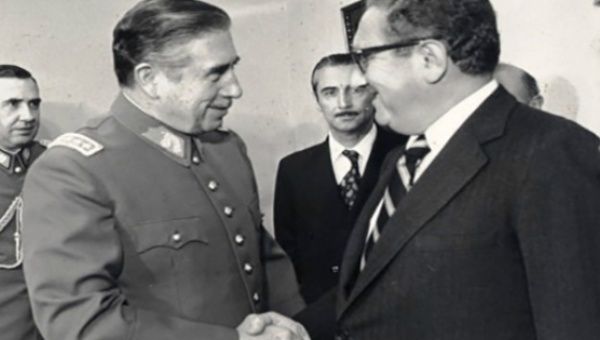 Chilean dictator Augusto Pinochet (L) greets U.S Foreign Secretary Henry Kissinger (R) in 1976 as Operation Condor is launched.