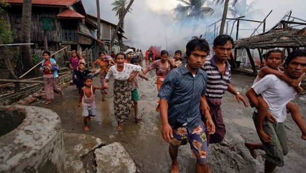 More than 30,000 people have fled to Bangladesh, escaping the violence which has renewed international criticism that Aung San Suu Kyi