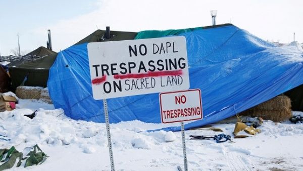 A modified "No Trespassing" sign is seen in the opposition camp against the Dakota Access oil pipeline near Cannon Ball.