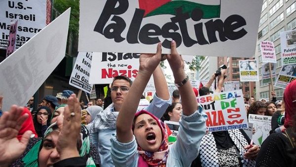Protesters shout "Free Palestine" during a march in midtown Manhattan, New York, July 9, 2014.