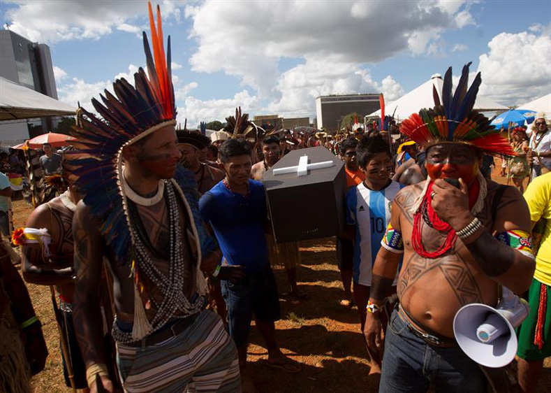 Brazilian Indigenous people take part in a demonstration against the violation of Indigenous people