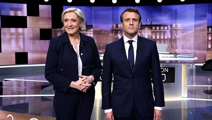 La candidata ultraderechista a la presidencia de Francia por el Frente Nacional, Marine Le Pen (i), y su rival, el socioliberal del movimiento ¡En Marcha!, Emmanuel Macron.