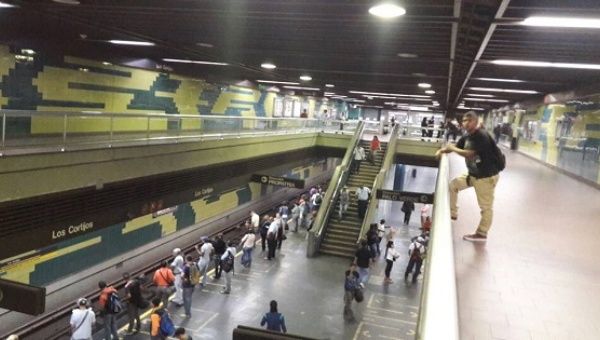 Venezuelan workers travel on Caracas