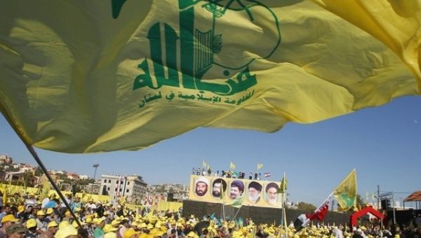 Hezbollah supporters wave the group
