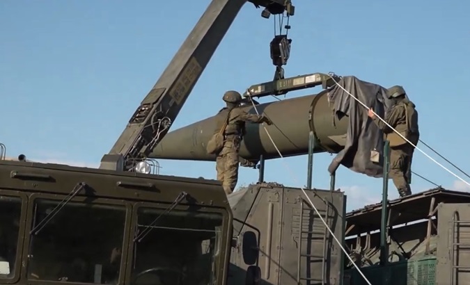 Russian soldiers unload missile system components, May 21, 2024.