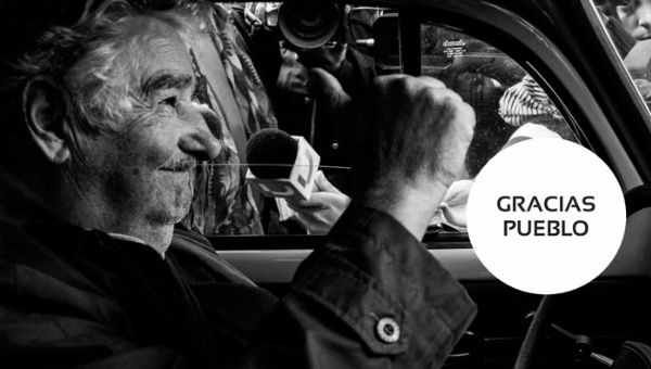 A photo of Mujica in black and white in which he appears driving his famous Beetle.