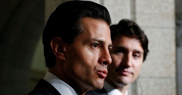 Mexico's President Enrique Pena Nieto (L) speaks during a news conference with Canada's Prime Minister Justin Trudeau on Parliament Hill in Ottawa, Ontario, Canada, June 28, 2016.