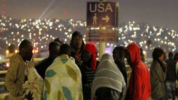 Haitians refugees wait to cross the U.S.-Mexican border