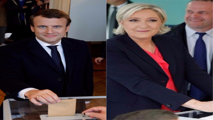 Emmanuel Macron (i) votó en Le Touquet, mientras Marine Le Pen lo hizo en Hénin-Beaumont.