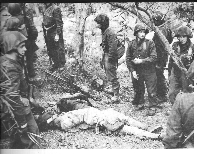 French soldiers standing over the bodies of Algerian fighters. “In the colonial countries, on the contrary, the policeman and the soldier, by their immediate presence and their frequent and direct action maintain contact with the native and advise him by means of rifle butts and napalm not to budge. It is obvious here that the agents of government speak the language of pure force” 