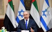 Arropado con banderas israelíes y árabes, el premier Netayanhu celebró la aprobación por su gobierno del acuerdo.